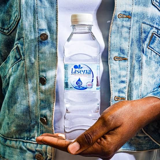 A Lasena bottle carried in a denim jacket pocket