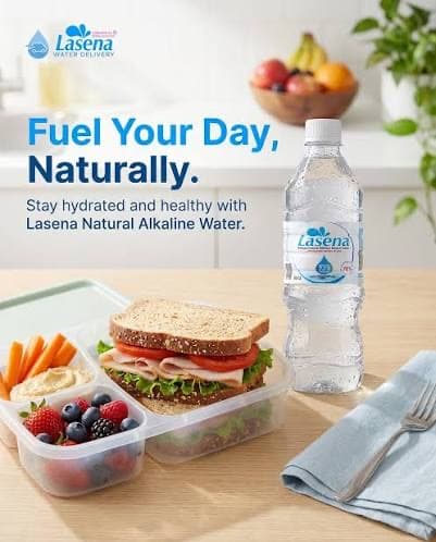Lasena campaign poster: Fuel Your Day, Naturally — a Lasena bottle beside a packed lunchbox